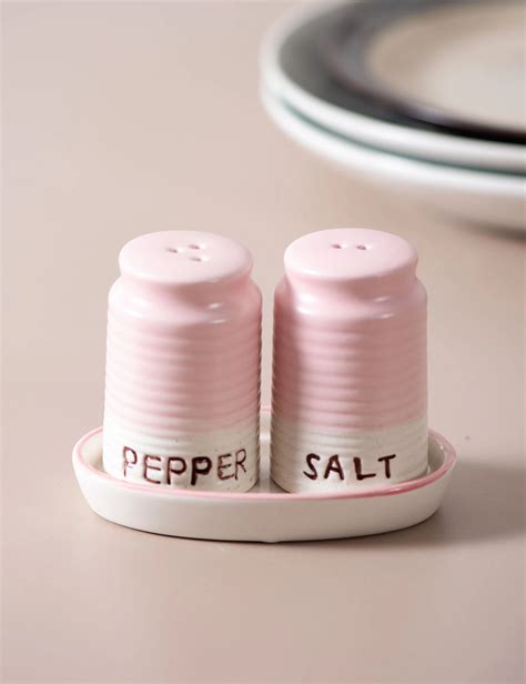Create a magical ambiance in your kitchen with pink magic wand salt and pepper shakers